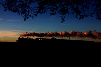 LMS Ivatt Class 2 2-6-0 No 46521 is silhouetted against the setting sun along the Quorn Straight on 29.12.14 with 1515 Loughborough - Leicester North GCR Christmas Holiday Service