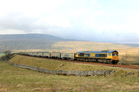 GBRf Class 66 No 66713 'Forest City' at Ribblehead on 26.3.24 with 6E69 1254 Ribblehead Vq Gbrf to Hunslet Tilcon Gbrf loaded stone wagons