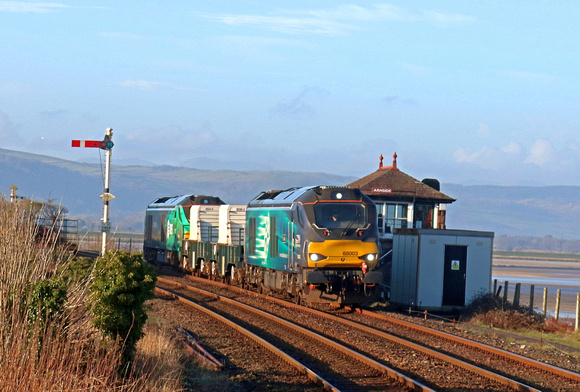 DRS 68003 'Astute' leads 2 Nuclear Flasks with DRS 68006 in green livery (HVO fuel) at rear on 11.1.22 passes Arnside Signal Box with 6C51 1247 Sellafield B.N.F. to Heysham Harbour P.S. working