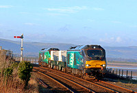 DRS 68003 'Astute' leads 2 Nuclear Flasks with DRS 68006 in green livery (HVO fuel) at rear on 11.1.22 at Arnside with 6C51 1247 Sellafield B.N.F. to Heysham Harbour P.S. nuclear working