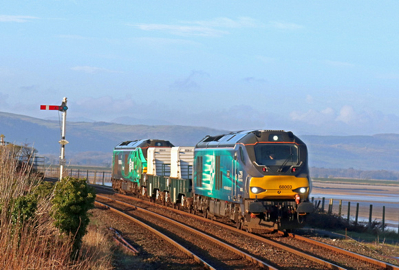 DRS 68003 'Astute' leads 2 Nuclear Flasks with DRS 68006 in green livery (HVO fuel) at rear on 11.1.22 at Arnside with 6C51 1247 Sellafield B.N.F. to Heysham Harbour P.S. nuclear working