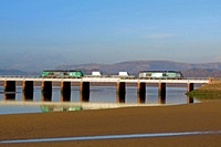 DRS 68003 'Astute' leads 2 Nuclear Flasks with DRS 68006 in green livery (HVO fuel) at rear on 11.1.22 over Arnside Viaduct with 6C51 1247 Sellafield B.N.F. to Heysham Harbour P.S. working (SMB)