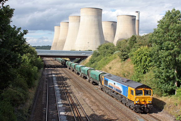 GBRf 66709 'Sorrento' in M.S.C livery is dwarfed by the Cooling Towers of  Ratcliffe P.S. at Ratcliffe on Soar, MML on 11.8.14 with 6V08 1414 Tunstead Sdgs - Brentford Town Days loaded lime green hopp