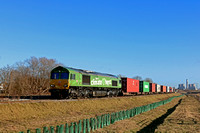 DB Cargo 66004 in special green “I am a Climate Hero” livery waits at Gateway West Junction on 19.1.21 with 4L38  1057 East Mids Gateway Tml Dbc to Felixstowe Central Dbc Intermodal