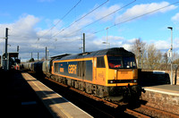 GBRf Class 60 No 60095 Whernside powers through East Boldon Tyne & Wear Metro station on 25.1.25 with 6H70 1224 Tyne Coal Terminal Gbrf to Drax Aes (Gbrf) loaded Biomass hoppers