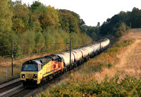 Colas Rail Class 70 No 70803 passes through Plawsworth cutting full of autumn colours near Durham, ECML on 5.10.24 with 6S29 1230 Hunslet Yard Colas Rail to Oxwellmains Lafarge Colas empty cement tank