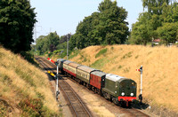 Preserved Class 20 No D8001 in green approaches Rothley station on 2.8.24 with 1430 Loughborough to Leicester North service at the GCR Diesel Running Day with 31108 and D8001