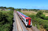 TfW Class 197 No 197007 is seen at Valley, Anglesey, North Wales on 24.6.24 with 1V96 1233 Holyhead to Ludlow service. This service was cancelled between Ludlow & Cardiff Central due to a train proble