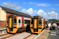 TfW Class 158 No 158828 at Tywyn station on 6.6.24 with 2J19 1408 Birmingham International to Pwllheli passing TfW Class 158 No 158820 waiting with 2G65 1537 Pwllheli to Machynlleth service