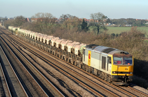 EWS 60076 in two tone grey livery at Cossington, MML heading towards Syston East Junction on  12.2.08 with  6E63 1510 Mountsorrel Sdgs - Peterborough loaded self discharge La Farge stone hoppers