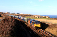 GBRf Class 60 No 60087 Ingleborough heads along the Durham Coast south of Seaham on 11.11.24 with 6H70 1219 Tyne Coal Terminal Gbrf to Drax Aes (Gbrf) loaded Biomass hoppers