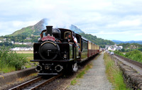 Double Fairlie 'James Spooner'  powers across The Cob, Porthmadog on 12.6.24 with 1040 Porthmadog to Bl. Ffestiniog 'Mountain Spirit' service on the Ffestiniog and Welsh Highland Railways Narrow Gauge