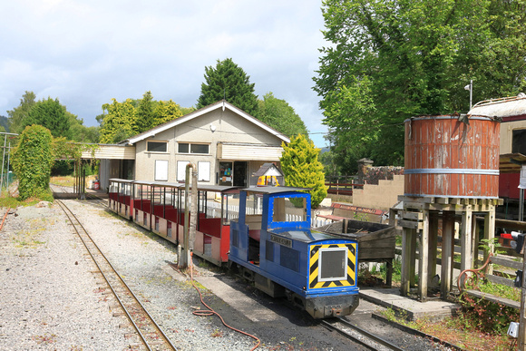 Diesel loco Gwydir Castle waits with a mini train at Conwy Valley Railway Museum miniature railway at Betws-y-Coed, in the Conway Valley seen on 5.7.24