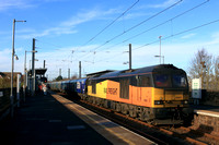GBRf Class 60 No 60047 Scafell Pike passes through East Boldon station on 19.11.24 with 6H70 1219 Tyne Coal Terminal Gbrf to Drax Aes (Gbrf) loaded Biomass hoppers
