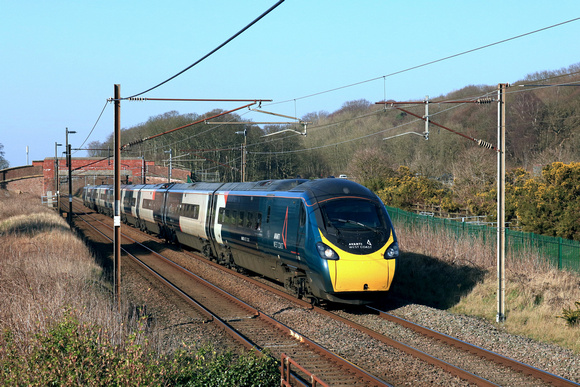 Avanti West Coast Class 390 Pendilino No 390050 races past Woodacre Near Garstang, Lancs on 6.3.25 with 1M13 1240 Glasgow Central to London Euston service