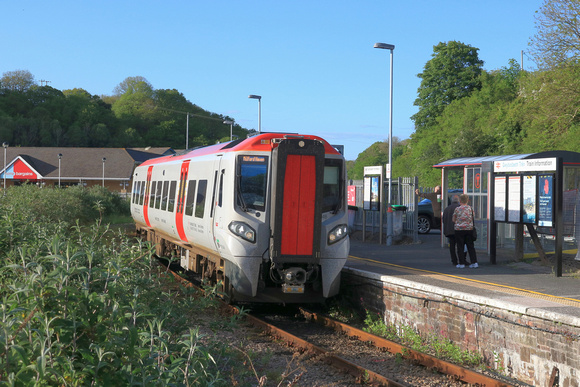 Transport for Wales Class 197 No 197046 arrives at the end of the line at an overgrown Milford Haven station on 15.5.24 with 1B42 1549 Cardiff Central to Milford Haven service