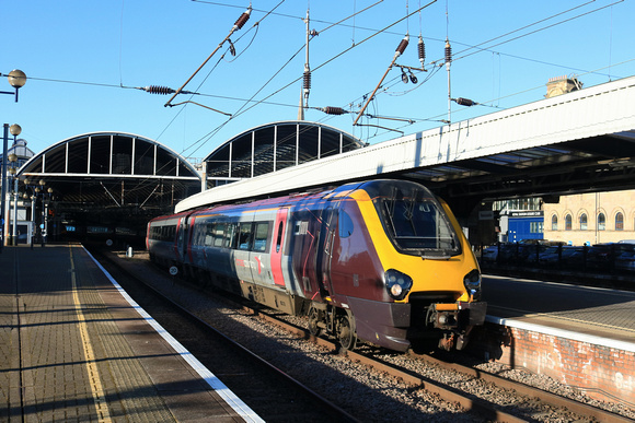 CrossCountry Class 220 Voyager No's 220033 leading and 220030 burst into the sunlight at Newcastle station on 30.1.24 with 1S33 0703 Birmingham New Street to Edinburgh service