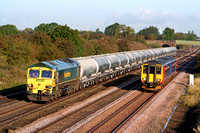 66603 at Cossington, MML on 8.10.08 with 0735 6V84 Earles - Theale loaded La Farge cement tanks outpaces EMT 156414 with 0650  Sleaford - Leicester service