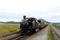 Double Fairlie 'James Spooner'  powers across The Cob, Porthmadog on 12.6.24 with 1040 Porthmadog to Bl. Ffestiniog 'Mountain Spirit' service on the Ffestiniog and Welsh Highland Railways Narrow Gauge