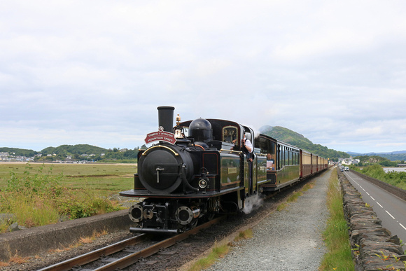 Double Fairlie 'James Spooner'  powers across The Cob, Porthmadog on 12.6.24 with 1040 Porthmadog to Bl. Ffestiniog 'Mountain Spirit' service on the Ffestiniog and Welsh Highland Railways Narrow Gauge