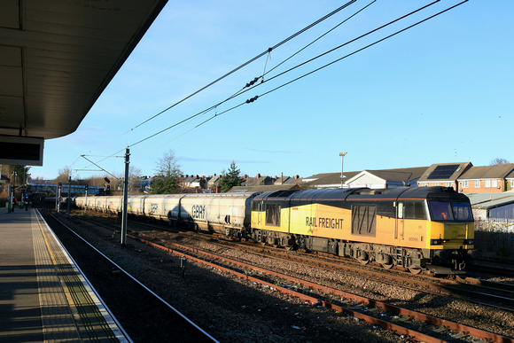 GBRf Class 60 No 60096 Skiddaw still in old Colas livery passes Tyne & Wear Pelaw Station on 19.12.24 with 6N19 0959 Lynemouth Power Stn (Gbrf) to Tyne Coal Terminal Gbrf emepty biomass hoppers
