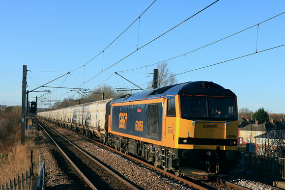 GBRf Class 60 No 60056 Great Gable nears the Tyne and Wear Metro station of Fellgate on 7.1.25 with 6N19 0959 Lynemouth Power Stn (Gbrf) to Tyne Coal Terminal Gbrf empty Biomass hoppers