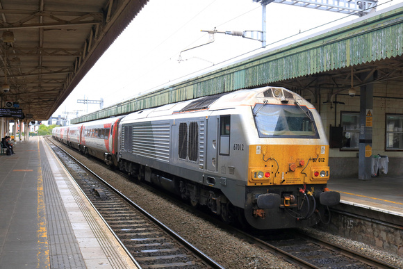 DB Cargo Class 67 No 67012 at rear of TfW 1V37 0830 Manchester Piccadilly to Cardiff Central service at Cardiff Central station on 29.4.24 with DVT 82216 up front