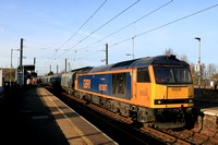 GFBRf Class 60 No 60087 Ingleborough powers through East Boldon station on 13.11.24 with 6H70 1219 Tyne Coal Terminal Gbrf to Drax Aes (Gbrf) loaded Biomass hoppers