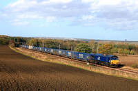 DRS Class 66 No 66108 powers past Plawsworth near Durham on 20.10.24 with 4E65 0952 Coatbridge (Drs) to South Bank Tees Dock (Drs) short Tesco Intermodal