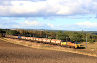 Colas Rail Freight Class 70 No 70810 passes Plawsworth near Durham on 27.9.24 in charge of 6D43 1541 Jarrow Prax to Lindsey Oil Refinery Colas empty bogie tanks