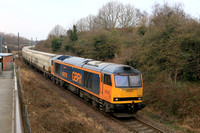 GBRf Class 60 No 60076 Cross Fell passes to the rear of Brockley Whins station on the Tyne Dock branch on 19.2.25 with 6N19 0959 Lynemouth Power Stn (Gbrf) to Tyne Coal Terminal Gbrf empty biomass hop