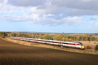 In lovely autumn light, LNER Class 800 No 800107 powers past Plawsworth near Durham on 20.10.24 with SuN 1E17 0940 Inverness to York service