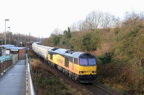 GBRf Class 60 No 60096 in ex Colas livery takes the freight only line at Brockley Whins station on 4.12.24 leaving the shared main & Tyne & Wear Metro line with 6N19 0957 Lynemouth Power Stn (Gbrf) Bi