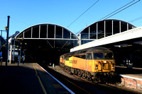 Colas Rail Class 56 No 56105 and Colas Rail Class 66 No 66849 Wylam Dilly bursts out into the sunlight at Newcastle station on 30.1.25 with 6S31 0635 Doncaster Up Decoy to Millerhill S.S. departmental