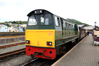 Built 1967 Vale Of Ffestiniog diesel loco waits at Portmadog station, Ffestiniog and Welsh Highland Railways on 17.6.24 with empty stock for Boston Lodge Workshops at the end of the Cob, Porthmadog