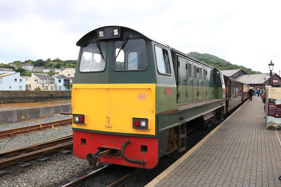 Built 1967 Vale Of Ffestiniog diesel loco waits at Portmadog station, Ffestiniog and Welsh Highland Railways on 17.6.24 with empty stock for Boston Lodge Workshops at the end of the Cob, Porthmadog