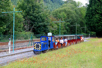 Diesel loco Gwydir Castle leads a mini train around the grounds of the Conwy Valley Railway Museum miniature railway at Betws-y-Coed, in the Conway Valley seen on 5.7.24